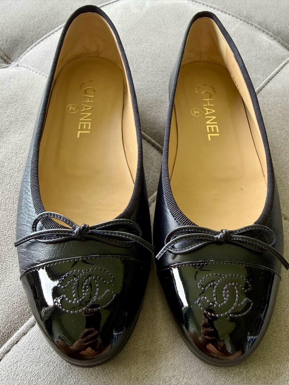 CHANEL Black Leather Ballerina Flats with Patent Cap Toe and Bow